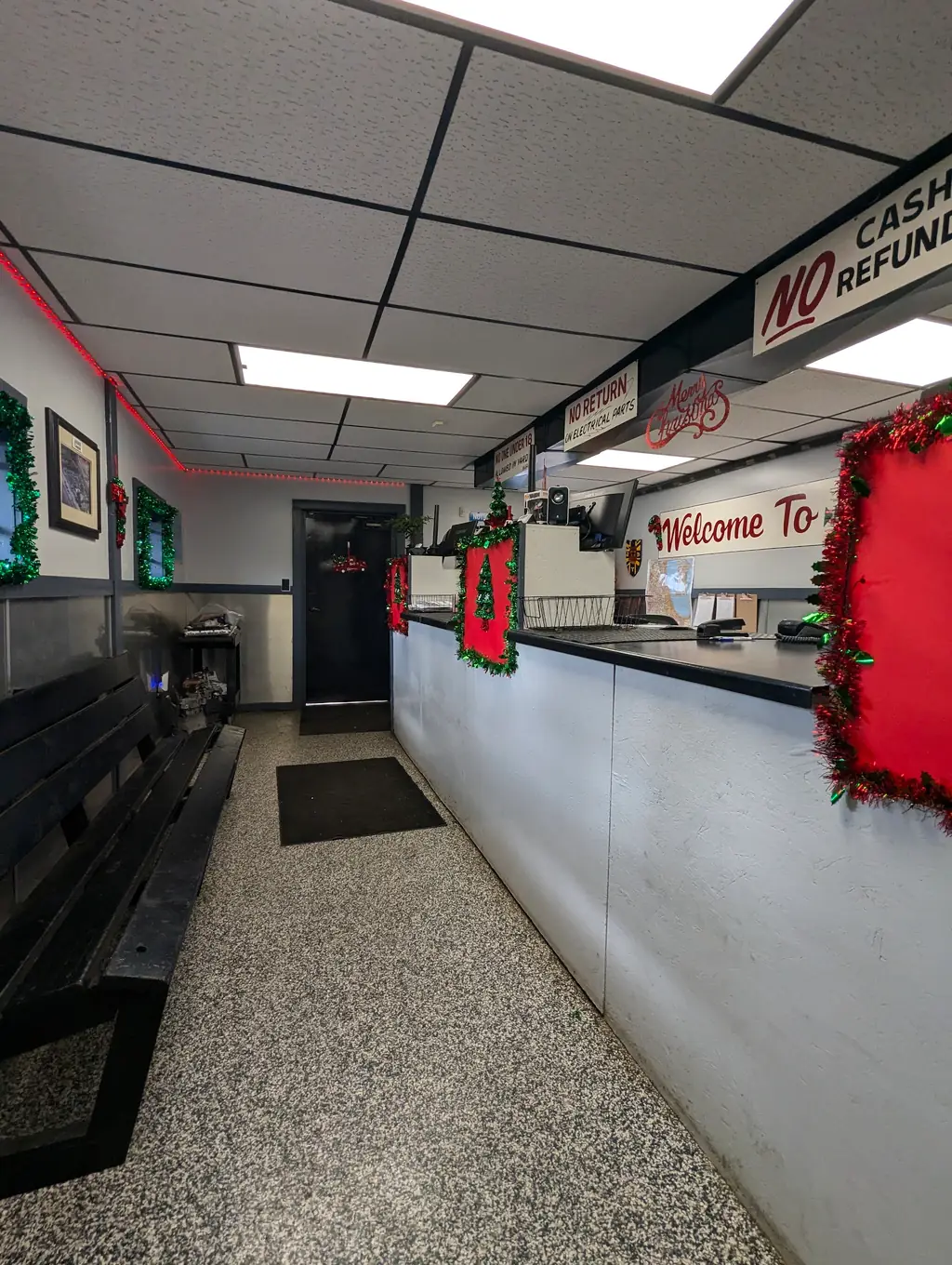 The waiting area at A-Affordable Auto Parts, signed welcome to A-Affordable