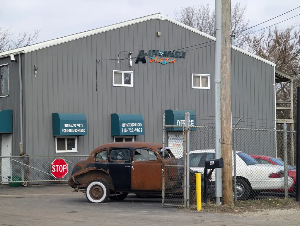 The A-Affordable Auto Parts shopfront on Patterson Road, awnings reading used auto parts foreign and domestic